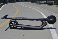 ES2 electric scooter folded on road