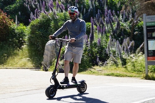 Man accelerating on the Dualtron Thunder electric scooter