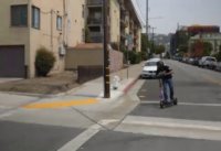 Man taking fast corner on Cruiser electric scooter