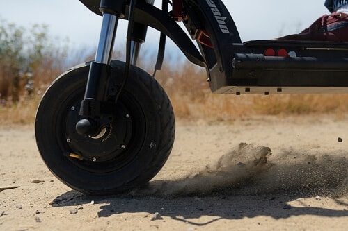 Wheel burnout in sand of Kaabo Wolf Warrior electric scooter