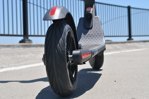 Close up of ES2 electric scooter front and rear tires