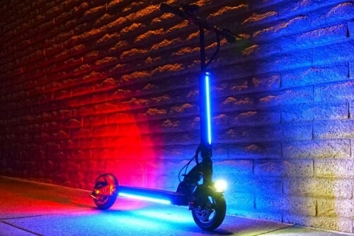 Electric scooter with all swag lights turned on at night