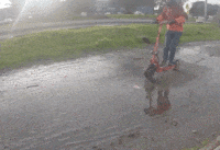 Man riding the QPower electric scooter through mud in slow motion