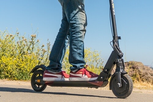 Man riding the E-TWOW GT electric scooter