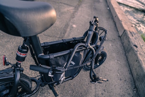 Fiido Q1S Seated Scooter - handlebars folded down, side view, cropped