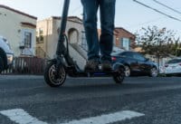 Man riding Hiboy Max V2 electric scooter on pavement