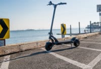 Kaabo-Mantis-8-electric-scooter-full-scooter-with-ocean-in-background