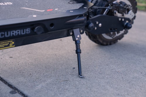 Currus Panther Electric Scooter - kickstand, charging port, cropped view