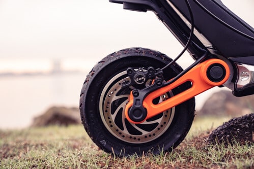Inokim OXO Electric Scooter - front wheel, single swingarm, hydraulic brake, pneumatic tire, cropped view, side view