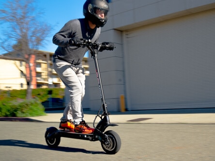 Man riding fast on Dualtron Eagle Pro electric scooter