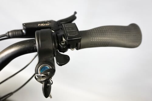Apollo Phantom electric scooter - close-up, thumb throttle, keystart ignition, handgrip, brake lever, button controls