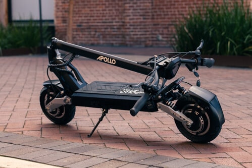Apollo Phantom electric scooter - scooter, folded, angled view, brick walkway