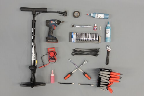 Scooter Racing - racing kit - tire pump, power drill, tire sealant, tape, tools, full view