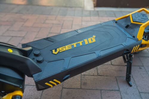 Rubberized deck of VSett 10+ electric scooter with logo